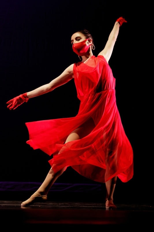 woman in red dress dancing