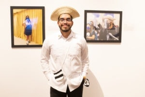 Panamanian student standing in front of art