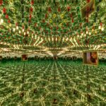 another Student looking through small window into infinity mirrors