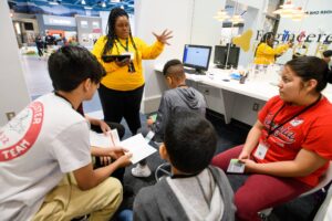 Brenau faculty and staff with middle school students teaching