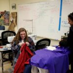 Savannah Cathers, right, and Aylssa Eblen work on costumes for a production of "Monstrous Regiment" in the Brenau University Costume Shop by the Gainesville Theatre Alliance, a partnership between Brenau and the University of North Georgia. (AJ Reynolds/Brenau University)