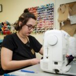 Shelby Strachan works on sewing costumes for a production of "Monstrous Regiment" in the Brenau University Costume Shop by the Gainesville Theatre Alliance, a partnership between Brenau and the University of North Georgia. (AJ Reynolds/Brenau University)