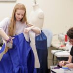 Mae Allison works on costumes for a production of "Monstrous Regiment" in the Brenau University Costume Shop by the Gainesville Theatre Alliance, a partnership between Brenau and the University of North Georgia. (AJ Reynolds/Brenau University)
