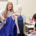 Mae Allison works on costumes for a production of "Monstrous Regiment" in the Brenau University Costume Shop by the Gainesville Theatre Alliance, a partnership between Brenau and the University of North Georgia. (AJ Reynolds/Brenau University)