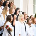 Nursing students pose for a photo on the steps of Pearce
