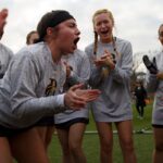 Brenau's Kailey Posea, a freshman from Cumming, Ga., cheers in a huddle before the first Brenau lacrosse match against Georgetown College on Friday, Feb. 9, 2018 in Gainesville, Ga. (AJ Reynolds/Brenau University)