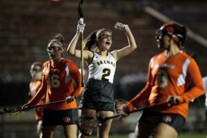 Brenau's Bonnie Lauman, a freshman from Waxhaw, N.C., celebrates after scoring the first goal in Brenau lacrosse history during the first Brenau lacrosse match against Georgetown College on Friday, Feb. 9, 2018 in Gainesville, Ga. (AJ Reynolds/Brenau University)