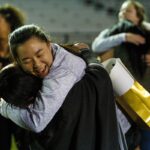 Brenau's Ashley Jou, a sophomore from Snellville, Ga., gives a hug after the first Brenau lacrosse match against Georgetown College on Friday, Feb. 9, 2018 in Gainesville, Ga. (AJ Reynolds/Brenau University)