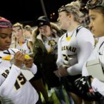 Brenau's Cameryn Brown, a freshman from Stockbridge, Ga., signs a commemorative lacrosse ball after the first Brenau lacrosse match against Georgetown College on Friday, Feb. 9, 2018 in Gainesville, Ga. (AJ Reynolds/Brenau University)