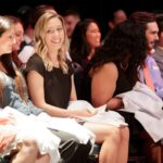 PA Students sitting with their white coats in their laps