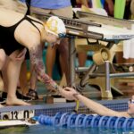 Swimmers shake hands.