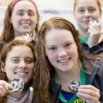 Swimmers show off their medals