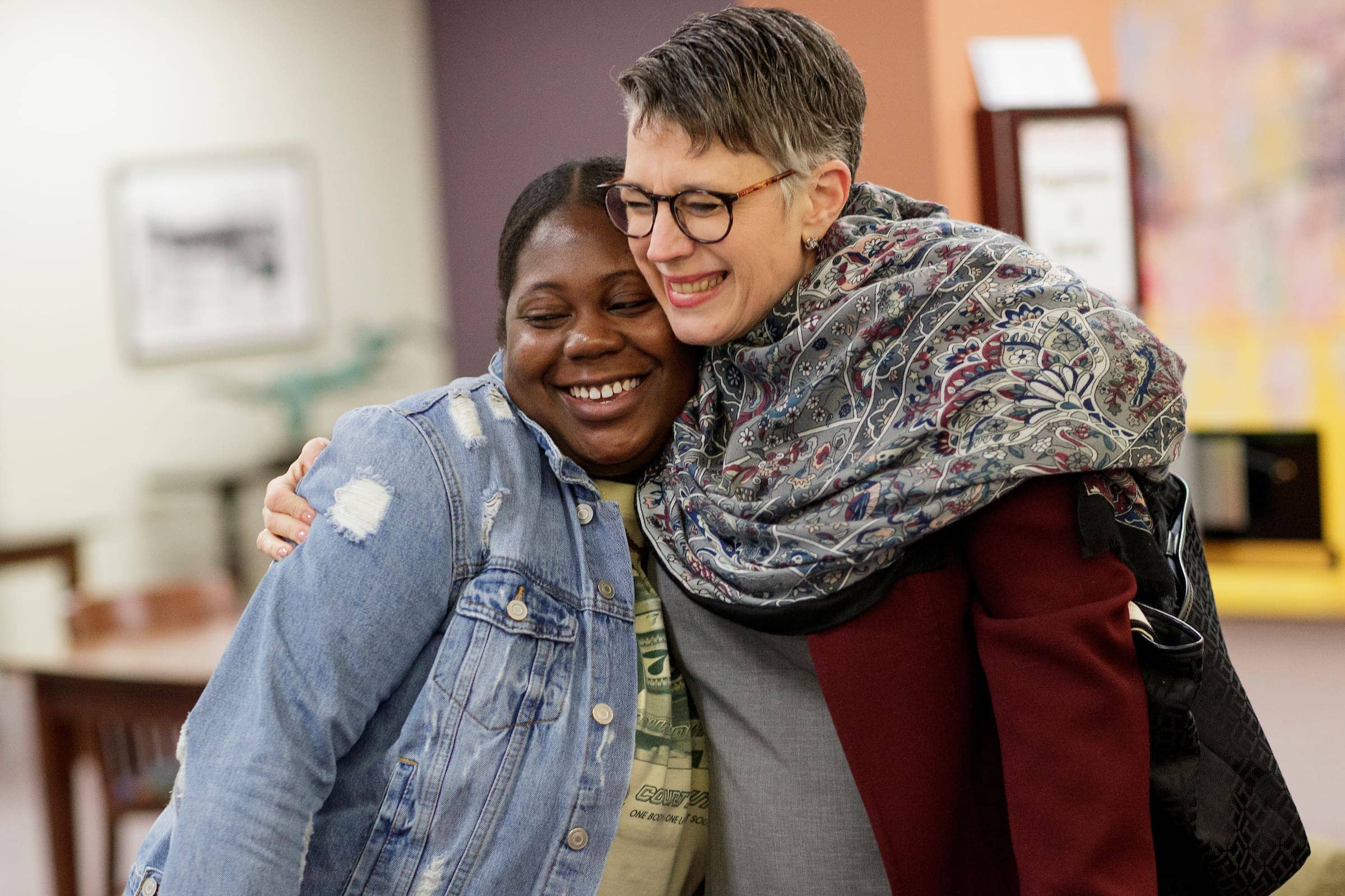 A student and President Skleder pose for a picture.