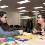 Two students make headbands.