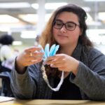 A student makes a headband.