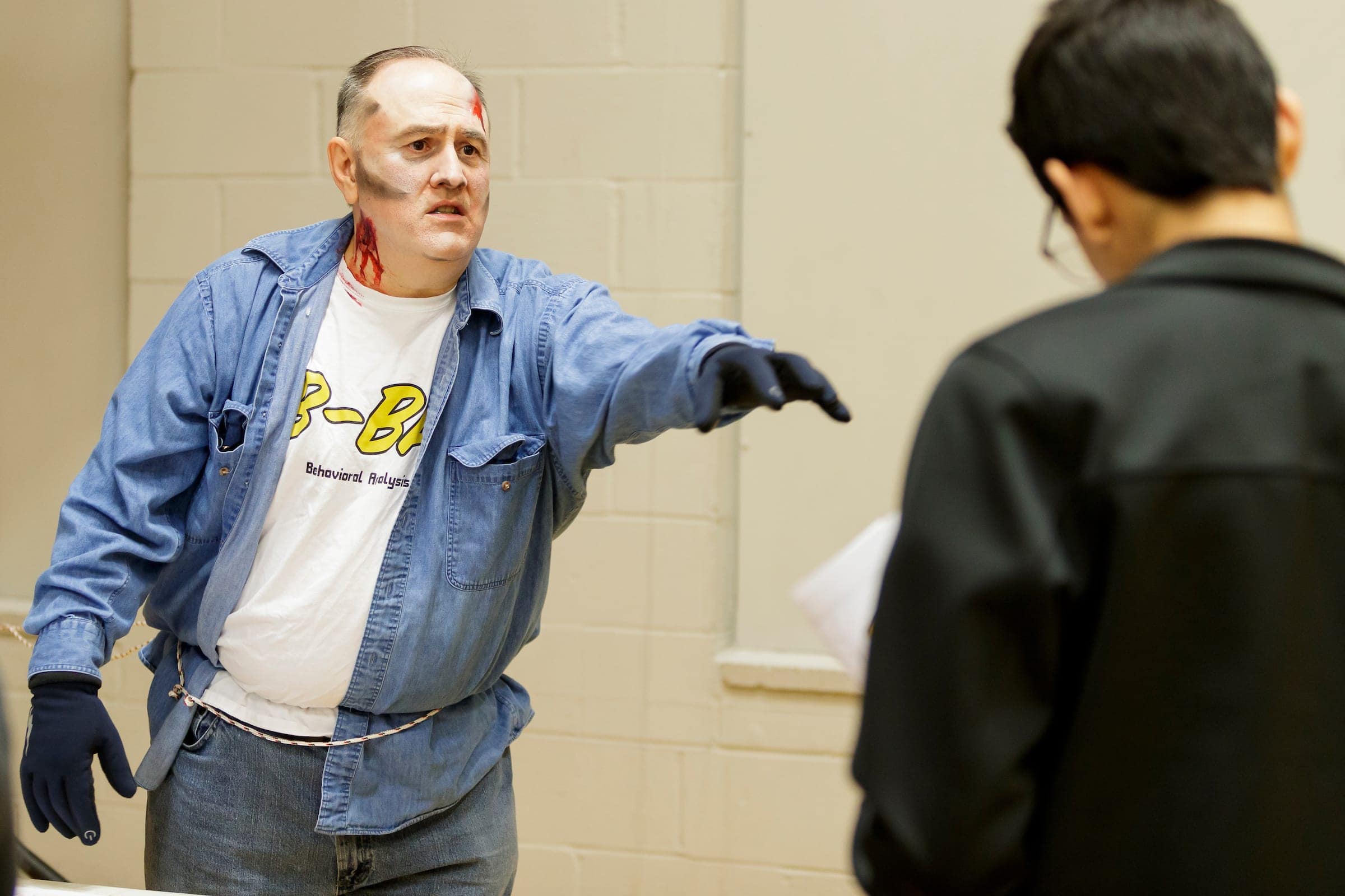 zombie reaches out at student