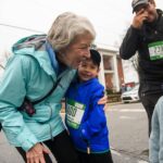 Grandmother hugs grandkid