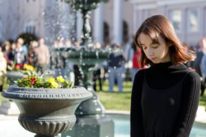 Nicole Miller stands in silence during a remembrance for the victims of the mass shooting at Marjory Stoneman Douglas High School. Brenau students, staff and faculty gathered around the Grace Hooten Moore Memorial Fountain and read the names of each victim after a bell rang from Grace Episcopal Church in memory. (AJ Reynolds/Brenau University)