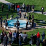 Brenau students, staff, faculty and administration members gathered for a remembrance for the victims of the mass shooting at Marjory Stoneman Douglas High School. The group stood in silence around the Grace Hooten Moore Memorial Fountain and read the names of each victim after a bell rang from Grace Episcopal Church in memory. (AJ Reynolds/Brenau University)