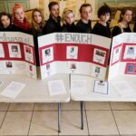 From left to right, Jessica Brannam, Tre'Linda Little, Nicole Miller, Shelby Strachan, Jasmine Holt, Josh Turner, Christina Hogg, Aaron Mott, Katie Davis, Sommer Stockton, Ananda Skyers and Olivia Eafano pose for a photo as a class after a remembrance for the victims of the mass shooting at Marjory Stoneman Douglas High School. Brenau students, staff and faculty gathered around the Grace Hooten Moore Memorial Fountain and read the names of each victim after a bell rang from Grace Episcopal Church in memory. (AJ Reynolds/Brenau University)