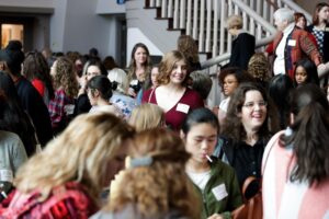 Guests mingle during the intermission at Women's Leadership Colloquium in the John S. Burd Center for the Performing Arts lobby. (AJ Reynolds/Brenau University)