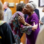 Monica Kaufman Pearson hugs woman