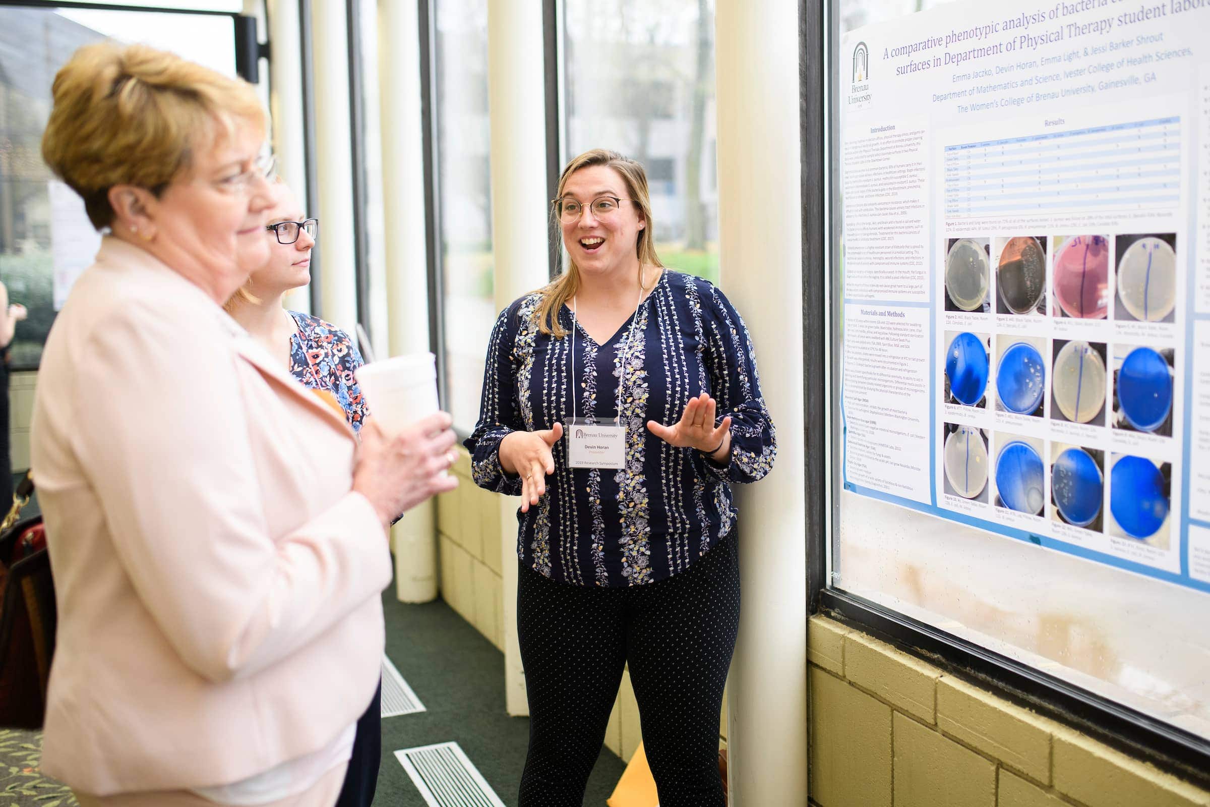 Devin Horan presents her project during the symposium.