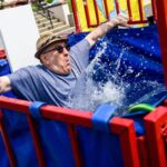 Perry Daughtry falls in the dunk tank during Ed Schrader Day.