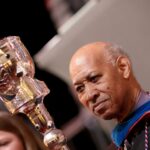 Professor Joe Green carries the mace during the Brenau University Honors Convocation on Thursday, April 12, 2018. (AJ Reynolds/Brenau University)