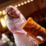 Elyssa Pate reveals herself as H.J the mascot during Class Day. (AJ Reynolds/Brenau University)