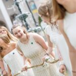 Junior students carry the daisy chain toward the Crow's Nest for Class Day. (AJ Reynolds/Brenau University)