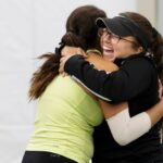 Juana Zambrano, left, celebrates with Valentina Pabon after Zambrano clinched the match for Brenau. (AJ Reynolds/Brenau University)