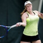 Kirsten Dickins hits a return during her match. (AJ Reynolds/Brenau University)