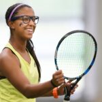 Evelin Gouveia reacts after winning a point in doubles. (AJ Reynolds/Brenau University)