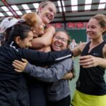 Brenau players hug after winning the final round of the Appalachian Athletic Conference women's tennis championships on Sunday