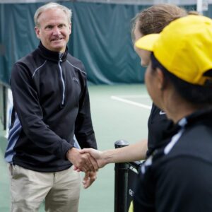 Michael Lochstampfor, Brenau athletics director, congratulates tennis players after the final round of the Appalachian Athletic Conference women's tennis championships on Sunday, April 22, 2018, in Chattanooga Tenn. Brenau defeated SCAD Atlanta 5-0 to win the AAC Championship.
