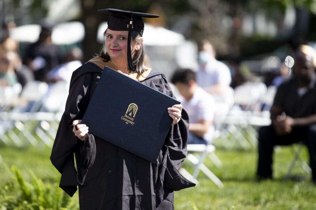 Student holding their diploma