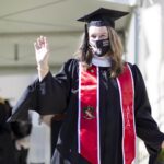 Sommer Stockton walks across the stage for her graduation