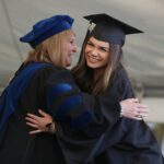 Kari Twyman hugs the dean of the women's college Debra Dobkins during the Women's College Commencement at Brenau University Friday May 4, 2018 in Gainesville, Ga. (Jason Getz for Brenau University)