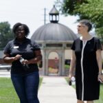 President Skleder is lead on campus tour by student Sahara Outler.