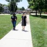 President Skleder on campus tour with student Sahara Outler.