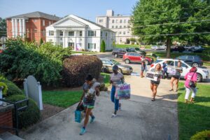 Members of the Brenau soccer team help new students move into their rooms in Crudup Hall.