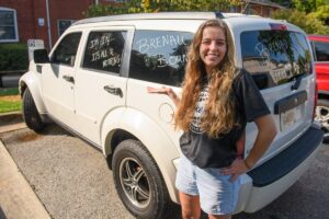 Hannah Brown poses with Brenau spirited car