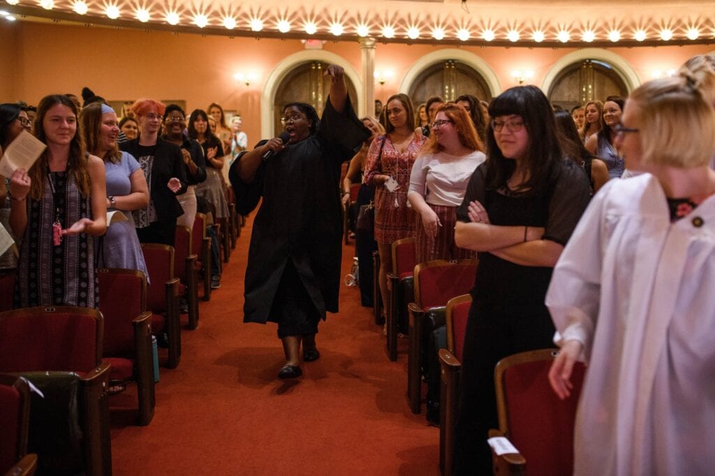 faculty member walking down the aisle