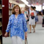 woman walking in library