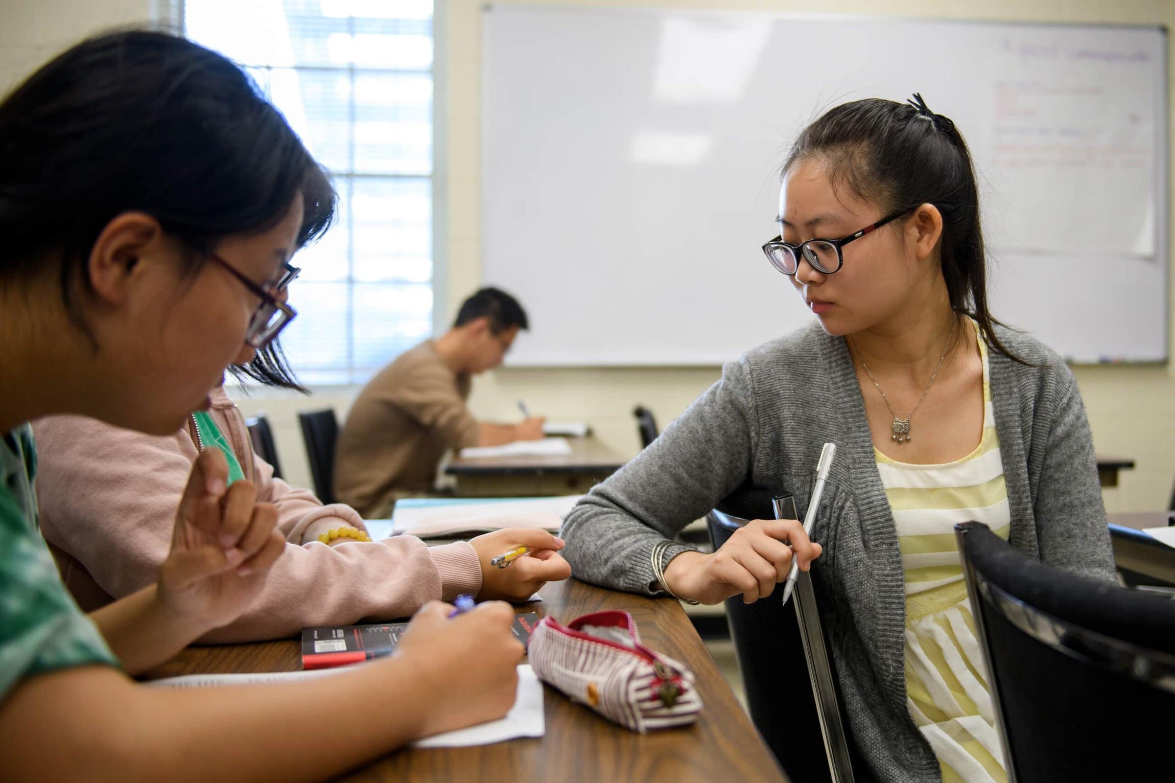 Yin "Hedy" Haiyan, a 2+2 education major, works on an assignment with classmates during an ON Language class at Brenau. (AJ Reynolds/Brenau University)