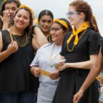 Students with their golden necklaces and tickets.