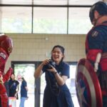 Tianyi "Alisa" Ma takes photos of Captain America and The Flash during LitFest at the Brenau University Downtown Center. (AJ Reynolds/Brenau University)