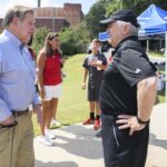 Brenau President Ed Schrader talks with Doug Ivester as Brenau and the University of Georgia softball teams play an exhibition doubleheader at Pacolet Milliken Field at the Ernest Ledford Grindle Athletics Park on Saturday, Sept. 22, 2018. (AJ Reynolds/Brenau University)