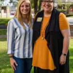 two faculty members posing for a photo